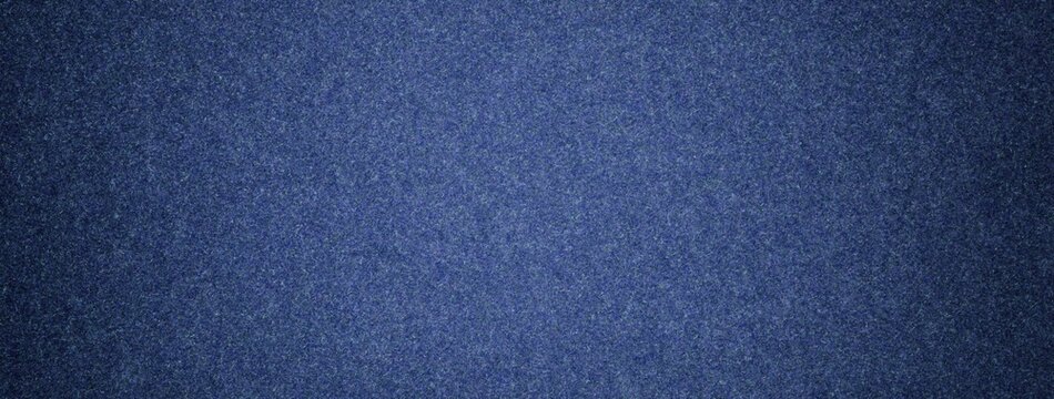 Dark blue suede fabric background with matte microfiber texture, soft navy felt surface with vignette in macro