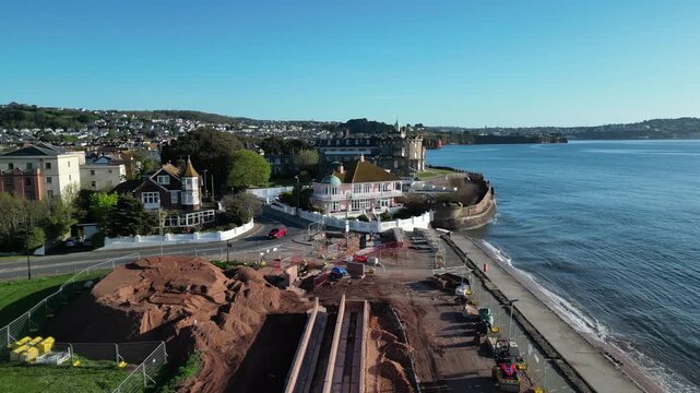 Paignton, Devon, England: DRONE VIEWS: A sea defence wall under construction on Paignton Green. The project will be completed in 2027 to protect seafront properties from global rising sea levels.