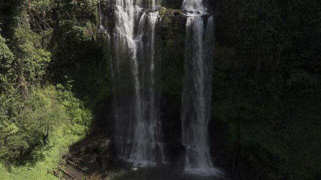 Spectacular Tad Yuang falls surrounded by tropical rainforest and scenic garden walkways - Drone footage HLG log