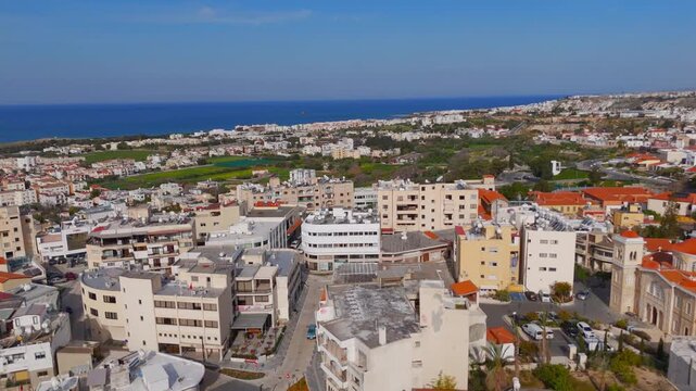 Low Drone Flight Over Paphos Residential Rooftops Towards Sea Shipwreck in Cyprus