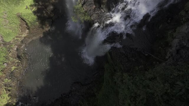 Thrilling zipline experience over Tad Fane twin waterfalls in Bolaven Plateau, Laos - Aerial drone shot ( HLG log )