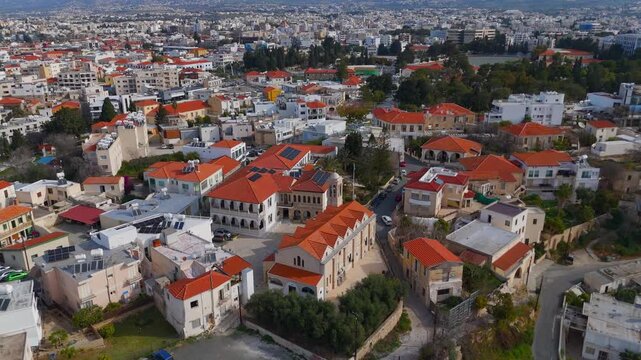 Aerial Drone Ascent from Holy Bishopric of Pafos to Wide Paphos Town Panorama Cyprus
