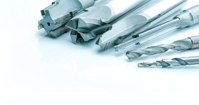 Special tools isolated on white background. Made to order special tools. Coated step drill and reamer detail. HSS cemented carbide. Carbide cutting tool for industrial applications. Engineering tools.