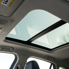 Naklejka premium Car sunroof open, clear glass, bright daylight, interior view.