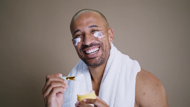 Beauty portrait of middle-aged hispanic black handsome man on colored background, concepts about beauty treatment, skincare and cosmetics for men	