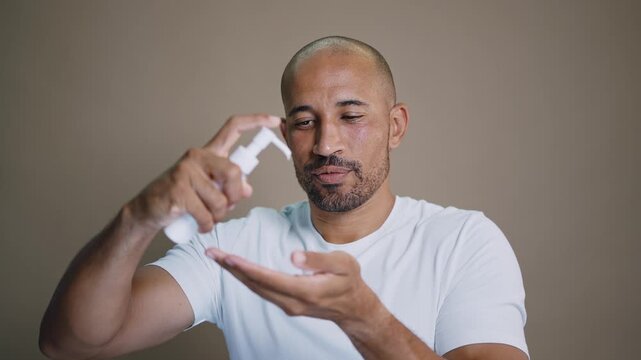 Beauty portrait of middle-aged hispanic black handsome man on colored background, concepts about beauty treatment, skincare and cosmetics for men	
