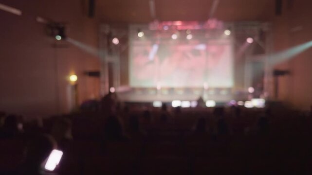 Stage light setup preparation. Calm stage scene with technicians adjusting sound and lighting. Serene theater environment with technicians finetuning cues before filming begins