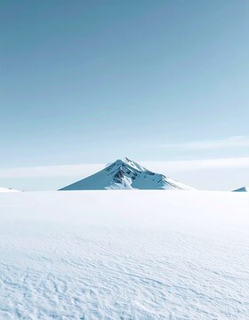 Serene Snow Field with Distant Mountain Peak