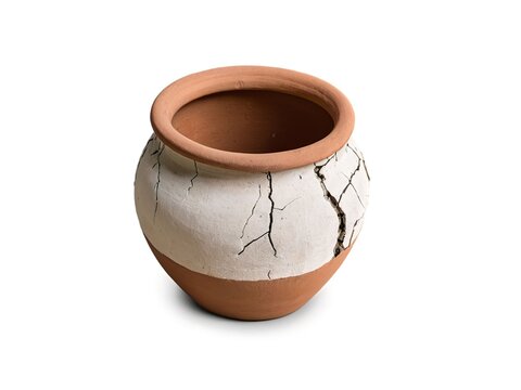 Cracked earthen pot isolated on white background