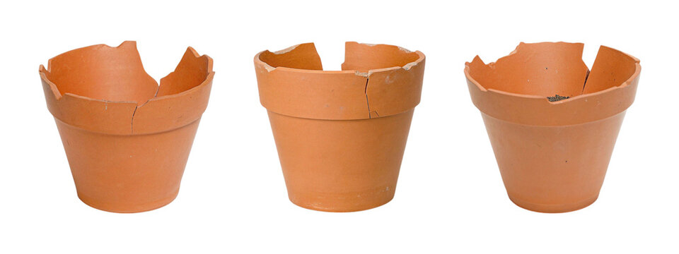 Cracked clay empty flower pot isolated on white background.