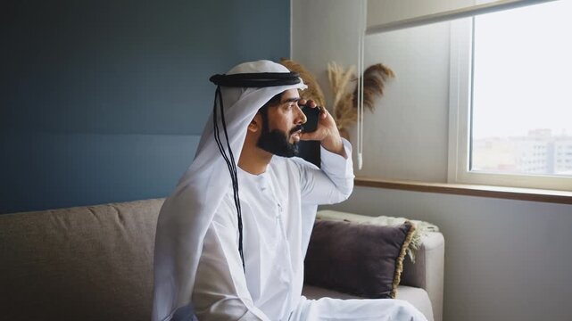 Men with dish dasha working in business office of Dubai. Portraits of successful businessmen in traditional emirates white dress. Concept about middle eastern cultures.