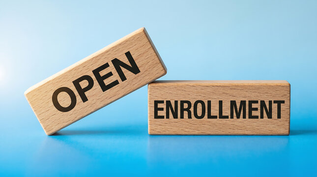 Wooden blocks with the words open enrollment symbolize opportunity and new beginnings for registration