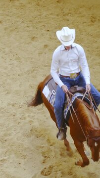 Tracking a western rider doing a pattern with horse slow motion