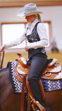 Attractive female western rider at a horsemanship competition