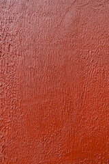 Fototapeta premium Red textured wall background with rough surface and subtle pattern, abstract backdrop ideal for copy space, design, and bold visual concepts