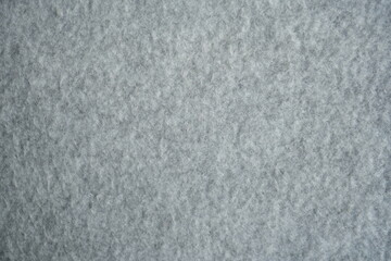 grey fleece fabric texture, macro texture fleece gray fabric photo above as background macro texture of grey fleece fabric. Close-up of soft synthetic textile surface with fine fibers and smooth fluf  © Анна Климчук