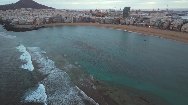 Aerial view of the beautiful Las Canteras beach in Las Palmas, Gran Canaria. Scenic cityscape with hotels and buildings by the coast