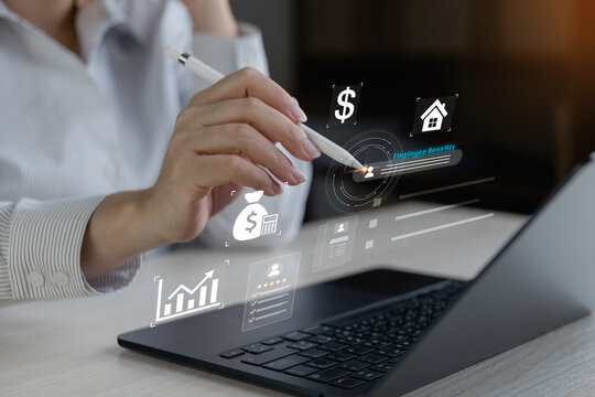 Professional using stylus on laptop with virtual employee benefits, payroll and finance icons, showing HR tech management and digital planning.