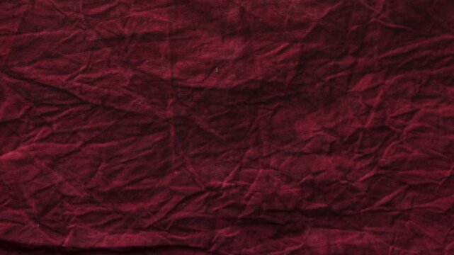red burgundy crinkled fabric texture background loopable 4k overlay with alpha channel. red crumpled linen fabric surface 4k.