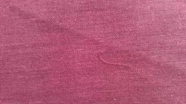 Elegant lite pink color cloth, fabric or sheet surface background texture. Fashion business and textile industry abstract stop motion loop animation.