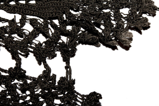 Close up of vintage black gothic lace fabric white on black background embroidery