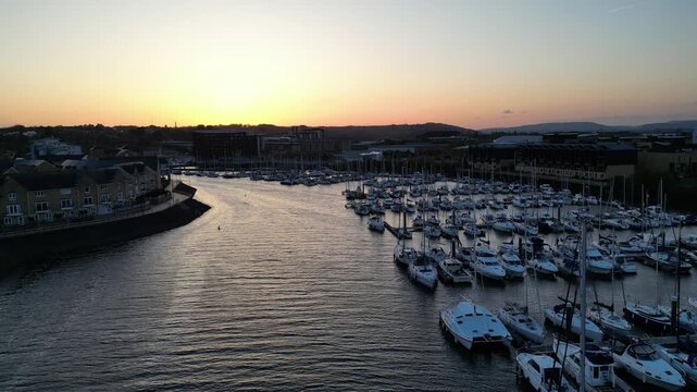 4K Cinematic Slow Aerial Shot at Penarth Marina Flying Along the River Ely, Cardiff, Wales During Sunset
