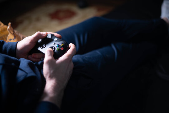 Xbox one console used authentic look, selective focus background image, real authentic playing video games