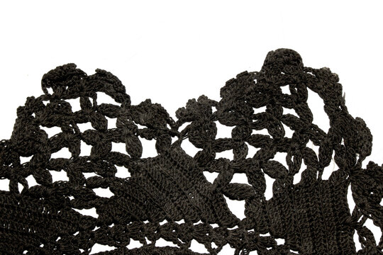 Close up of vintage black gothic lace fabric white on black background embroidery