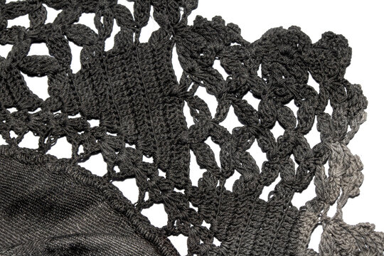 Close up of vintage black gothic lace fabric white on black background embroidery