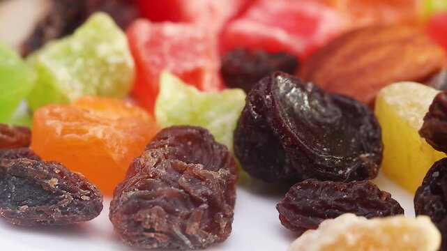 Detailed Macro Footage of Dark Raisins and Colorful Candied Fruit Cubes