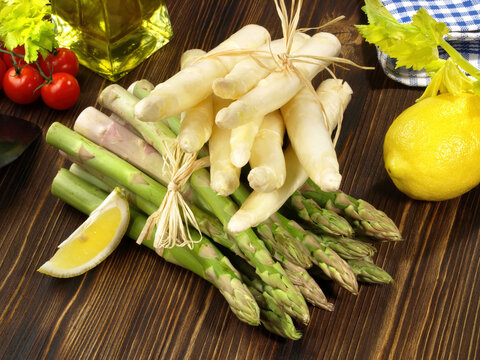 Green and White Asparagus on wooden Background