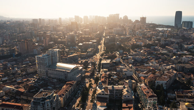 Urban skyline Batumi cityscape, drone panorama, coastal downtown growth, modern architecture, real estate development, travel destination, Black Sea metropolis.