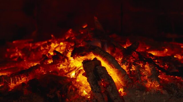 Wood burning in a cozy fireplace at home 4k footage
