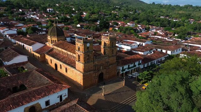 Aerial 360 degree orbit shot of the historic stone Cathedral of the Immaculate Conception in Barichara, Colombia