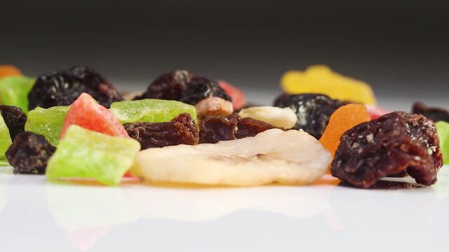 Low Angle View of Vibrant Dehydrated Fruit Mix on White Background