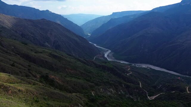 Breathtaking aerial view of the Chicamocha River flowing through the deep canyon mountains in Santander, Colombia