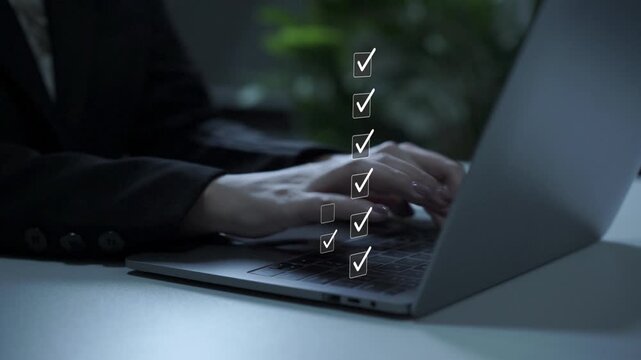 Businesswoman using laptop with digital checklist and document approval icons for performance tracking, survey evaluation, and workflow management.