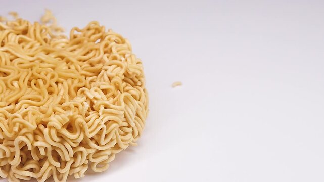 Raw Instant Noodles Block Macro Panning Shot on White Background