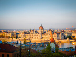 Fototapeta premium Hungarian Parliament Building, Parliament of Budapest. Aerial drone view of Budapest architecture, stunning historic building. Sunset and golden hour