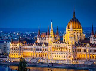 Obraz premium Illuminated Hungarian Parliament Building at night, Parliament of Budapest. Aerial drone view of Budapest architecture, stunning historic building