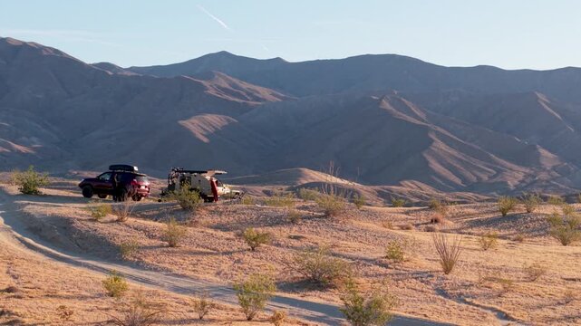View aerial shots of an SUV and teardrop camper at Thimble Trail in Anza Borego Desert State Park in California.