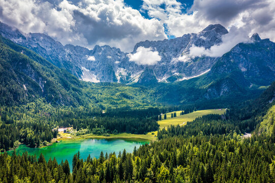 Lake of Fusine (Lago Superiore di Fusine) and the Mountain Range of Mount Mangart, Julian Alps, Tarvisio, Udine province, Friuli Venezia Giulia, Italy, Europe. Picturesque lake Lago Fusine in Italy.
