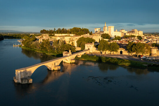 Beautiful view of Avignon with famous bridge Saint-Benezet, medieval architecture along the Rhone River in Avignon, France. The Pont Saint Benezet and the Papal palace in Avignon, South France.