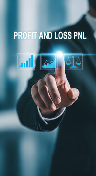 Businessman's finger touching a holographic display showing profit and loss pnl charts and a balance scale