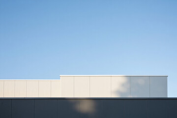 Fototapeta premium Modern building facade with geometric patterns and clear sky