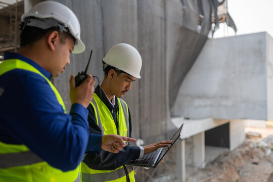 Construction workers collaborate on site urban construction zone engineering process daytime close-up teamwork in action