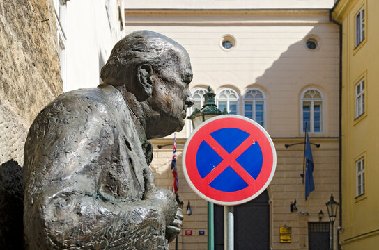 bust of the former premier minister Churchill in front of the british embassy at Prague with parking prohibited sign and EU flag before Brexit, Czech Republic