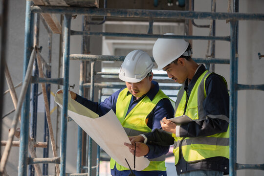 Construction project planning building site business meeting indoor workspace close-up view team collaboration for success