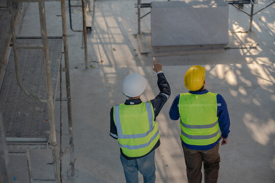 Construction planning meeting building site image industrial environment overhead view collaboration concept