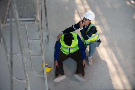 Emergency response action at construction site safety incident professional help indoor environment close-up view health risks